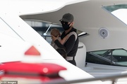 46106627-9845251-Precious_cargo_Orlando_s_pop_star_wife_Katy_could_be_seen_on_boa-a-25_1627680449033.jpg
