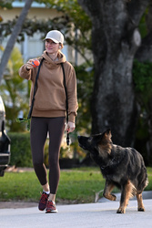 Gisele Bundchen - Out walking her dog in Surfside, Florida 02/22/2024