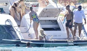 49770703-10142677-Getting_their_toes_in_After_a_bit_of_paddleboarding_and_swimming-a-129_1635465035494.jpg