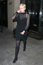 miley-cyrus-boots-and-pantyhose-06.jpg