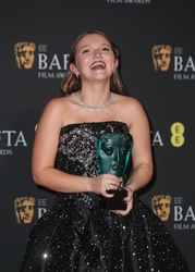 Mia McKenna-Bruce - Attends the EE BAFTA Film Awards 2024 at The Royal Festival Hall in London 02/18/2024