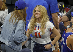 Sydney Sweeney courtside at 2026 NBA Finals Game 5 wearing white New York Knicks shirt, Sydney Sweeney and boyfriend Scooter Braun watching New York Knicks vs San Antonio Spurs in Texas, Close up photo of actress Sydney Sweeney smiling in custom Jalen Brunson number 11 jersey top, Hollywood star Sydney Sweeney wearing oversized vintage Knicks jacket at basketball game