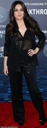 69876071-11977725-Sultry_She_left_the_outer_piece_unfastened_to_show_off_a_sheer_b-a-244_1681617836838.jpg