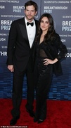 69876085-11977725-Dapper_He_was_dapper_in_a_black_tuxedo_which_he_paired_with_a_wh-a-245_1681617836854.jpg