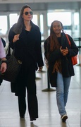 Angelina Jolie - Seen with her daughter at the JFK airport in New York City - January 13, 2023