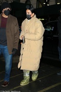 53502955-10453857-Coordinating_The_parents_were_dressed_in_similar_beige_tones_as_-a-2_1643411365273.jpg