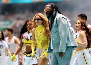 Shakira performing live on stage, 2026 FIFA World Cup opening ceremony, red glittering outfit dancing, stadium crowd cheering in background