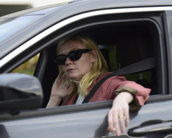 Kirsten Dunst - Is spotted smoking a mysterious cigarette in Los Angeles 02/27/2024